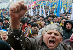 Man shouts slogans during rally organized by supporters of EU integration Independence Square in Ukraine
